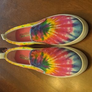 New in box. Woman's Skechers size 10 slip on sneakers